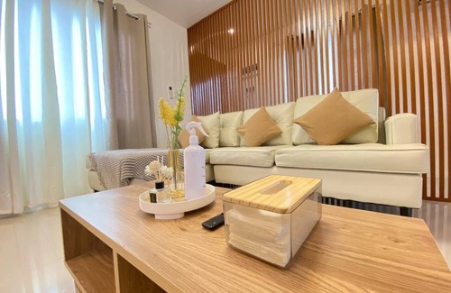 Butuan Bed & Breakfast | Rustic charm meets modern elegance at our wood & white retreat.