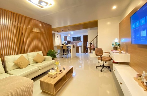 Butuan Bed & Breakfast | Rustic charm meets modern elegance at our wood & white retreat.