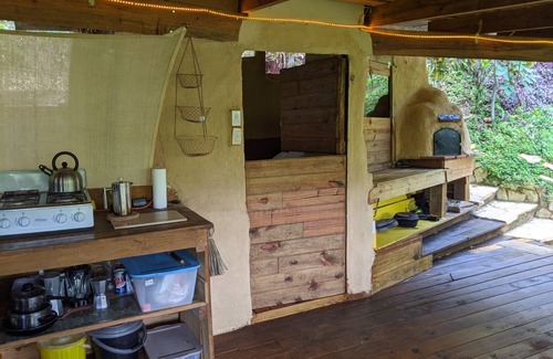 Jarabacoa Cottage | Rustic earthen two story cottage in Quintas del Bosque sleeps two couples.
