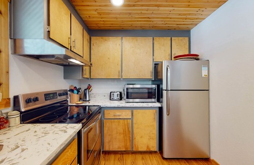 Tahoe Tyrol House | Rustic home with forest access, pool, hot tub, sauna, pool table, 2 fireplaces