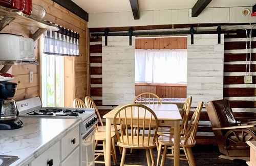 Garrison Resort | Rustic log cabin built in the 1900's! On Private Lake with Great Fishing.