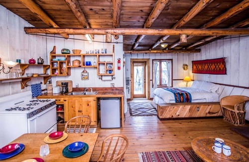 San Cristobal Cabin | Rustic Log Cabin on Eco-Friendly Farm near Taos, New Mexico