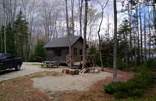 Franklin Cabin | Rustic off grid experience lakefront with beautiful sunrise view of Schoodic Mtn