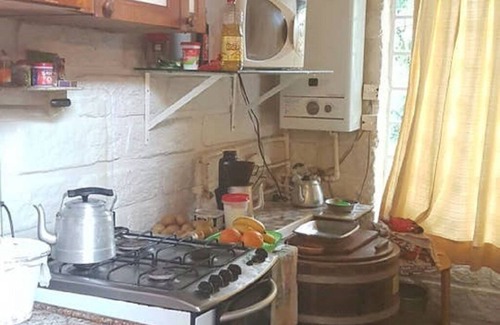 Sao Francisco de Paula House | Rustic Stone House in Condominium.