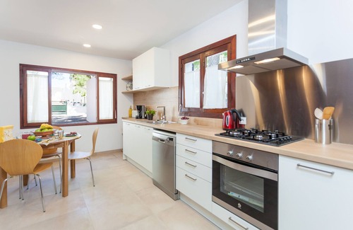 Cala Agulla House | Sa Torre Villa with pool very close to the beach and the town center.