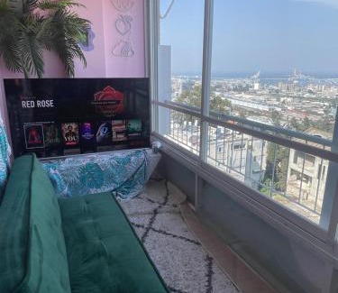 Haifa Apartment | sea view ,Colored, sunny & full of plants flat