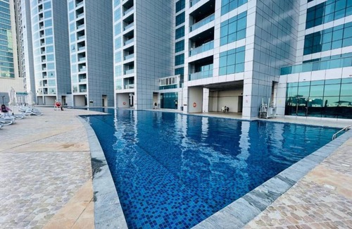 Rumailah Apartment | Seaside Gem – 2BR Beachfront Apartment