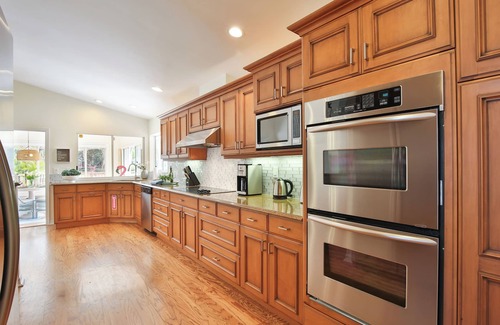 Palma Sola House | Seaside Sanctuary - 10 min to the beach, heated pool, water view, billiards