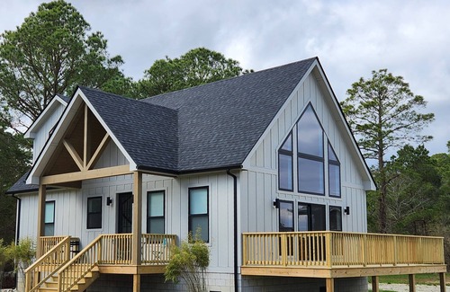 Marion Station House | Secluded waterfront getaway with hot tub,fire pit, and private dock.