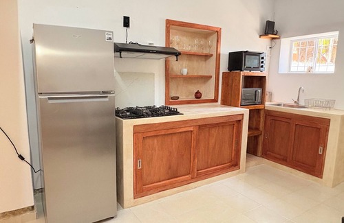 Chicxulub Puerto House | Serene 2-bedroom house with AC, pool & laundry station in Chicxulub Puerto