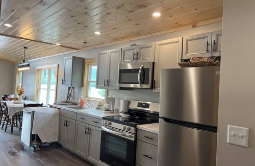 Brownville Cottage | Snowmobiler & Ice Fishing Paradise right on the water with mountain views!