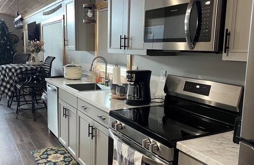 Brownville Cottage | Snowmobiler & Ice Fishing Paradise right on the water with mountain views!