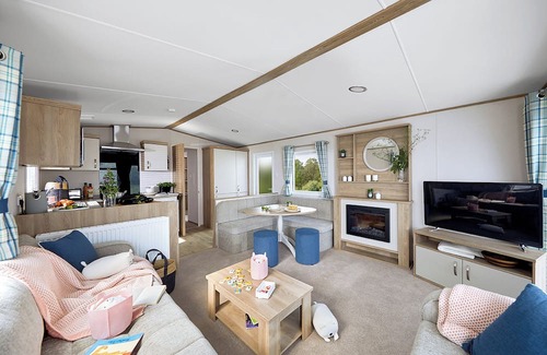 Llanllwchaiarn House | Spacious and modern 12ft-wide caravan with one double and two twin.