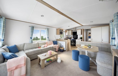 Llanllwchaiarn House | Spacious and modern 12ft-wide caravan with one double and two twin.