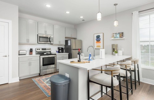 Olde Towne East Apartment | Spotless Monthly Penthouse | Garage Parking + Gym