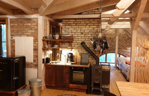 Graal Mueritz House | Stable building at the water tower with 2 vacation apartments without room walls on 2 floors