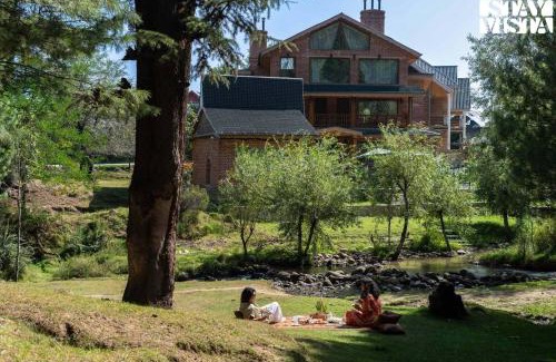 Srinagar Villa | StayVista at Swiss Chalet - Tangmarg with Gazebo & Lawn