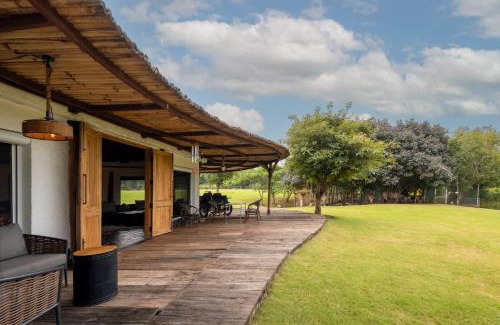 Indore Villa | StayVista's Water Song Garden - Lake-Side, Pet-Friendly Villa with Bar, Spacious Lawn & Indoor-Outdoor Games