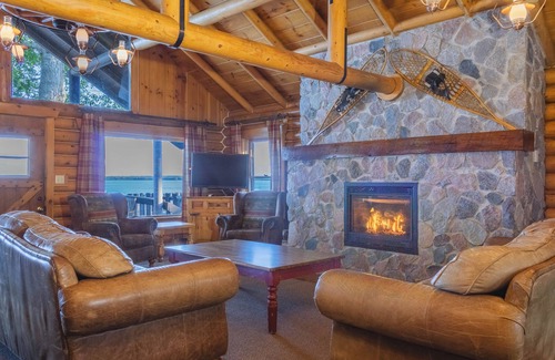 Walker Resort | Stunning Log Home on the water's edge with deck overlooking the swimming pool.