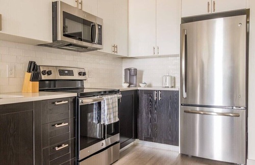 Downtown Louisville Apartment | Stunning Nulu 1BR CozySuites 01