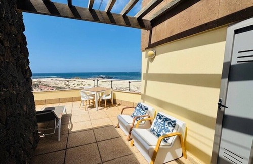 Los Lagos Apartment | Stunning views & location. Spacious 1 bed apartment directly on beach El Cotillo