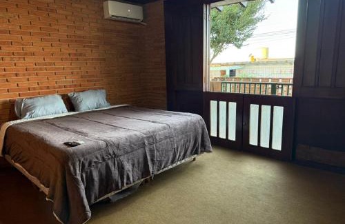 Botucatu House | Suíte king com ar condicionado