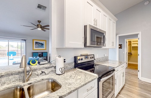 Summerfield House | Summerfield home with a fenced-in yard, pool, hot tub, & games