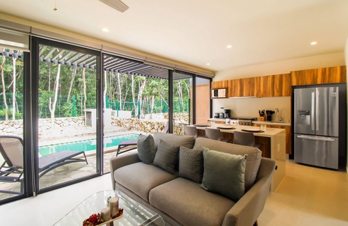 Tulum House | Sun-filled & dog-friendly resort home with outdoor pool, gym, patio, & courts