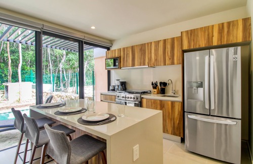 Tulum House | Sun-filled & dog-friendly resort home with outdoor pool, gym, patio, & courts