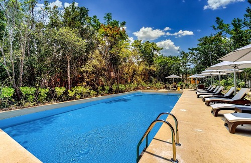 Tulum House | Sun-filled & dog-friendly resort home with outdoor pool, gym, patio, & courts