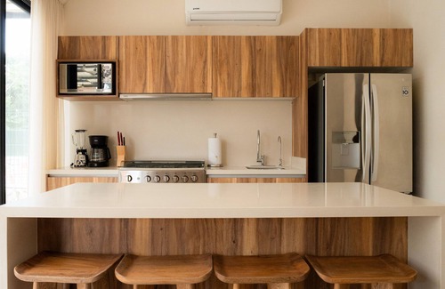 Tulum House | Sun-soaked & modern beach getaway with pool, generous patio, gym, & great views