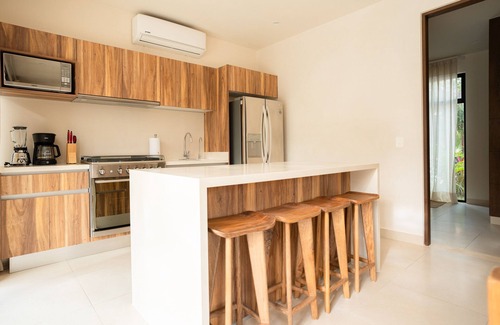 Tulum House | Sun-soaked & modern beach getaway with pool, generous patio, gym, & great views