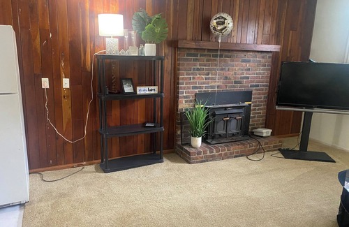 Auburndale House | The basement space nestled in a charming neighborhood and close to all amenities