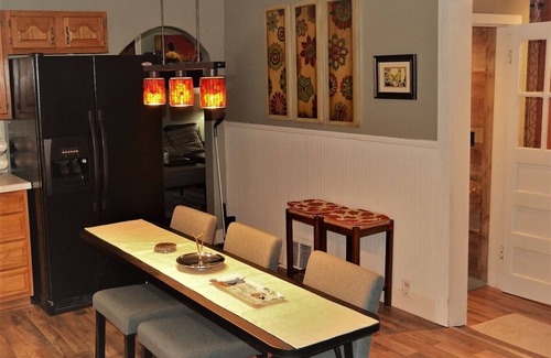 Grand Forks House | The Bungalow: inviting retreat with a spacious backyard sets for BBQs.