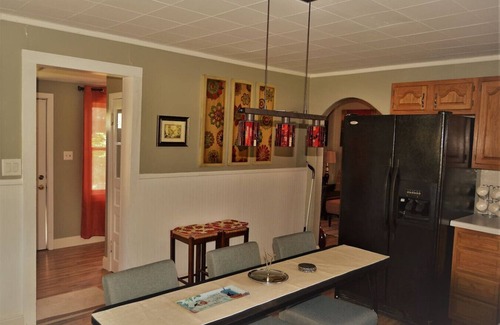 Grand Forks House | The Bungalow: inviting retreat with a spacious backyard sets for BBQs.