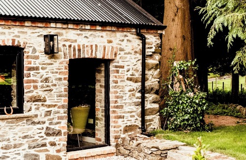 Downpatrick Villa | The Goat House Retreat offers an idyllic getaway.
