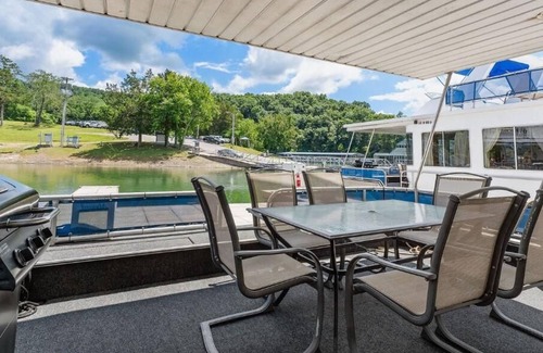 Allons Boat Rental | The Stillwater Houseboat 75' - Medium Houseboat, 6 bedrooms,waterslide, fireplace on rooftop lounge area