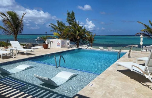 Colliers Bay Condo | The Tropical Breeze Oceanfront Studio Cottage in East End
