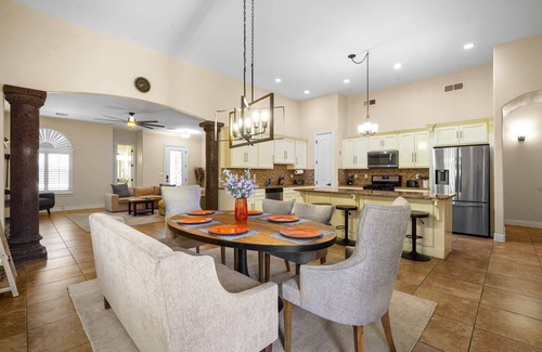 Biggs Field House | This is a true retreat in El Paso with a sparkling pool (w heater), hot tub, and full outdoor entertaining area with a 55" smart TV, tiki bar, and grill.