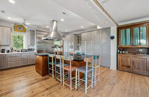 Debordieu Colony House | This vibrant family home features 8 bedrooms, and 8 bathrooms, ocean and creek views