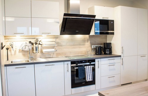 Butjadingen Apartment | Time out at Sielhuus - penthouse with a view. Sauna. Roof terrace. Exclusive.