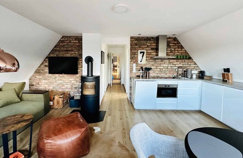 Wittduen Apartment | TIDE4 Amrum No. 7 - Modern apartment with wood-burning stove. 100m to the sea. Dogs welcome!