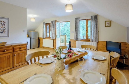 Westleigh Ski Chalet | Timber lodge set in an elevated woodland position with views of the lake.