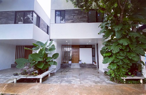 Tizimin House | Tizimín retreat: stylish townhouses, natural harmony, modern comforts.