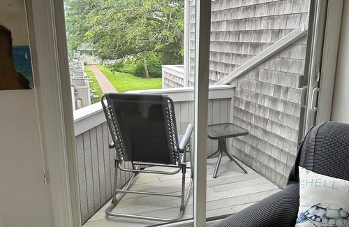 Hyannis House | Townhouse less than one-minute walk to a private beach and heated pool on site
