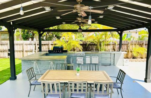 Liberty City House | Tropical Paradise 3BR Oasis with Heated Pool and Summer Kitchen
