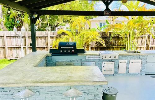 Liberty City House | Tropical Paradise 3BR Oasis with Heated Pool and Summer Kitchen