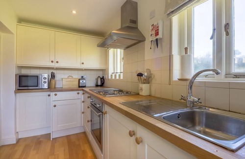 Caerhays Cottage | Turreted gatehouse to the historic Caerhays Castle located on the beach on the south Cornish Coast