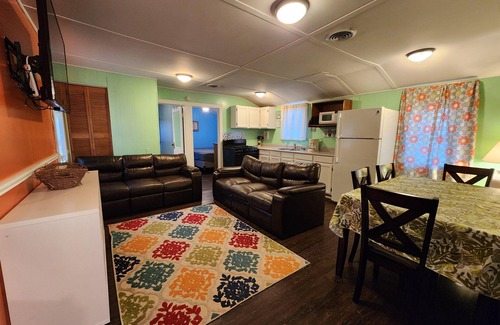 Monticello Cabin | Two Bedroom Cabin - Street & Pool View - Two bedroom cabin conveniently located at Outrigger Resort, right down the road from Indiana Beach Amusement Park! This 600 sq ft classic cabin offers two (2) queen beds and two (2) futons to sleep six (6)! Am