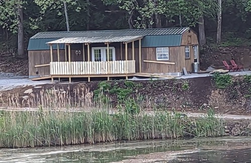Jasonville Cabin | Unique cozy 14x40 Cabin with a nice deck by the water .